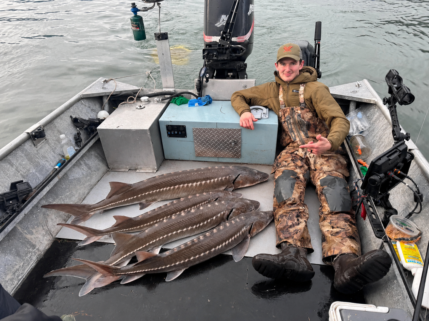 Angler aboard the Fin Addict boat with several sturgeon from a sturgeon outing